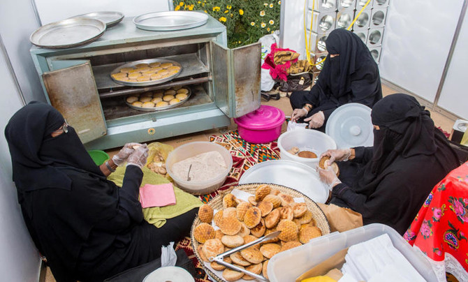 Bahraini productive families showcasing their home-based products and small businesses at a local marketplace.
